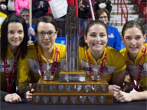 Team Manitoba — left to right: skip Kerri Einarson, third Val Sweeting, second Shannon Birchard and lead Briane Meilleur — poses with the trophy after winning the Scotties Tournament of Hearts on Sunday night at Mosaic Place in Moose Jaw.