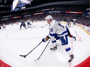 Tampa Bay Lightning left wing Ondrej Palat, 18, controls the puck ahead of Colorado Avalanche left-winger J.T. Compher during a Feb. 17 NHL game at Pepsi Center. Rob Vanstone enjoyed listening to the broadcast on the Altitude Radio Network.