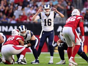 Rams quarterback Jared Goff (16) prepares to snap the football during first half NFL action against the Cardinals at State Farm Stadium in Glendale, Ariz., on Dec. 1, 2019.
