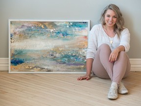 Artist Justine Schlosser sits with a piece of her art at The Local Market in Regina. This piece will be auctioned during a Habitat for Humanity gala event.