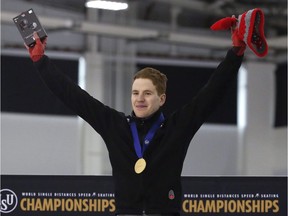 Moose Jaw's Graeme Fish celebrates on the podium after winning the men's 10,000 metres in world-record time Feb. 14 at the world single distances long-track speed skating championships.