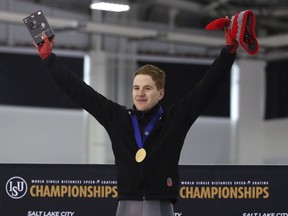 Moose Jaw's Graeme Fish celebrates on the podium after his win in the men's 10,000 metres during the world single distances speed skating championships Friday in Kearns, Utah. Fish won the event in world-record time.