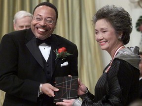 Governor General Adrienne Clarkson presents the Governor General's Literary Award for poetry to George Elliott Clarke, of Toronto and originally of Windsor Nova Scotia, during a ceremony at Rideau Hall official residence of the Governor General in Ottawa, Wednesday, November 14, 2000. Emails show the University of Regina's dean of arts told George Elliott Clarke that he was sorry the acclaimed poet had been "vilified" over his relationship with a killer of an Indigenous woman in the city. Clarke was also hopeful he would be invited back to the school someday.