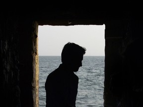 Prime Minister Justin Trudeau looks out from the 'Door of No Return' at the slave house on Goree Island, Dakar, Senegal on Wednesday, Feb. 12, 2020.