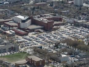 An aerial photo shows the Regina General Hospital. A proposed parkade is meant to be located on the northwest corner of the existing parking lot on the hospital's grounds, which is visible on the right hand side of this photograph.