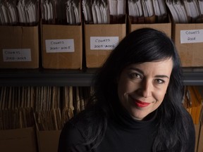 Journalist Jana Pruden sits near archival material in the Leader-Post office on Mar. 1, 2020. Pruden is delivering the 2020 Minifie Lecture at the University of Regina on March 3.