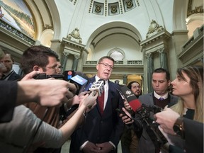 Premier Scott Moe speaks with reporters after the opening of a new session at the Legislative Building in Regina on Monday, March 2, 2020.