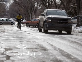 A cyclist makes their way northbound in a designated bike lane on Lorne Street just south of Victoria Avenue in Regina on Tuesday, March 3, 2020.