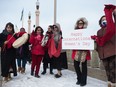 People stand on the Albert Street bridge in a group to show their support for women on International Women's Day in Regina, Saskatchewan on Mar. 8, 2020. BRANDON HARDER/ Regina Leader-Post