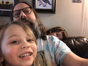 Regina dad Marc Spooner (centre) spent the day at home with his children Ansel, 3, (left) and Thomas, 6, (right) on Monday, something many parents will be doing come March 20 when elementary and high schools shut down under orders from the province.