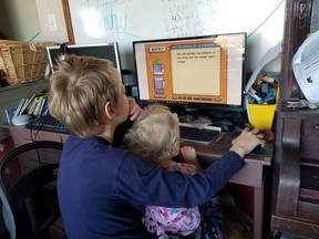 Rod Amberson's children play a math game online as part of a homeschooling lesson. (Photo courtesy of Rod Amberson)
