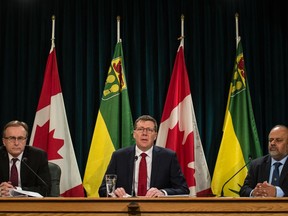 Saskatchewan Premier Scott Moe speaks to reporters at a media conference regarding the province's response to COVID-19 at the Saskatchewan Legislative Building in Regina, Saskatchewan on Mar. 18, 2020. On frame left is Saskatchewan Health Minister Jim Reiter. On frame right is Saskatchewan's Chief Medical Health Officer Dr. Saqib Shahab.