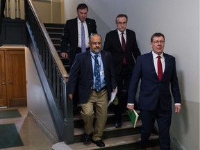 From right, Saskatchewan Premier Scott Moe, Health Minister Jim Reiter, Chief Medical Health Officer Dr. Saqib Shahab and Deputy Premier Gord Wyant walk down the steps of the west wing of the Saskatchewan Legislative building on their way to a media conference regarding the province's response to COVID-19 on March 18, 2020.