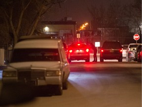 REGINA, SASK : March 21, 2020  -- Regina police speak with someone in front of a home on the corner of 11th Avenue and Atkinson Street in Regina, Saskatchewan on Mar. 22, 2020. An officer at the scene indicated someone had been injured. BRANDON HARDER/ Regina Leader-Post