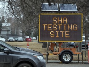 Portable signs indicating where the SHA testing site is in Regina on Tuesday, March 31, 2020.