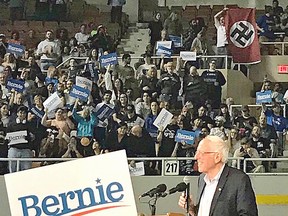 Bernie Sanders (I-Vt.) did not appear to see the Nazi flag behind him Thursday night at Arizona Veterans Memorial Coliseum. 'Whoever it was, I think they're a little outnumbered tonight,' he later told the crowd.