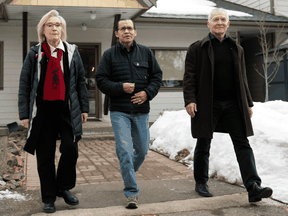 Wet'suwet'en hereditary leader Chief Woos, centre, Crown-Indigenous Relations Minister Carolyn Bennett, and B.C. Indigenous Relations Minister Scott Fraser arrive to speak to reporters in Smithers, B.C., March 1, 2020.