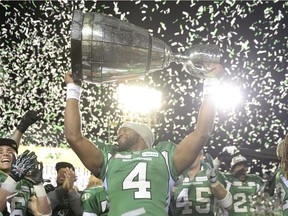 REGINA, SASK - Nov. 24, 2013  -  Saskatchewan Roughriders quarterback Darian Durant (#4) hoists the Grey Cup in victory at the end of the 101st Grey Cup game held at Mosaic Stadium in Regina, Sask. on Sunday Nov. 24, 2013.