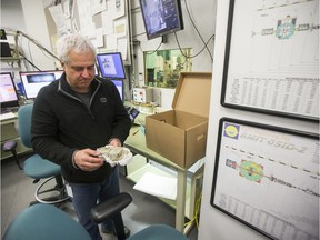 Mauricio Barbi, a University of Regina researcher in Saskatoon to use the synchrotron, displays some dinosaur coprolite, fossilized dinosaur feces, at the Canadian Light Source in Saskatoon on March 11, 2020.