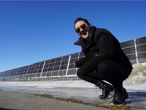 Leah Mertz poses in front of a bank of solar panels at Southeast College in Estevan , Saskatchewan on Feb. 23, 2020. Photo by Leah Mertz.