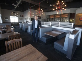 Jim Werschler, who is an operating partner for 16 Boston Pizza locations in Saskatchewan, stands inside a quiet restaurant on Star Lite Street in Regina on Thursday, April 2, 2020.