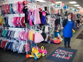 Peggy Hlushko, owner of Once Upon a Child on Avonhurst Drive, stands inside the store, which is still operating based on a curbside service during the COVID-19 pandemic in Regina, Saskatchewan on April 3, 2020.