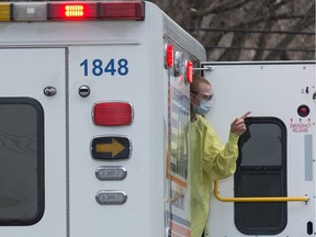 A paramedic attends a call in Regina on April 7, 2020.