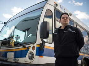 Kevin Lucier, president of ATU Local 588, stands next to a bus outside the City of Regina transit operations centre on Winnipeg Street in Regina, Saskatchewan on April 21, 2020.
