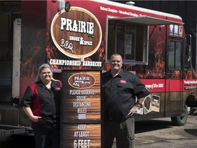 Rob Reinhardt, owner/operator of Prairie Smoke & Spice, and his wife and co-owner Jacy at their shop with their food truck in Regina on Thursday, April 23, 2020.