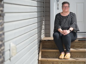 Christall Beaudry, executive director for CNIB Saskatchewan, sits on the step at her home in Regina, Saskatchewan on April 29, 2020.