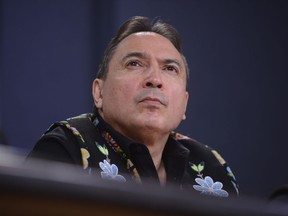 Assembly of First Nations (AFN) National Chief Perry Bellegarde listens during a press conference at the National Press Theatre in Ottawa on Tuesday, Feb. 18, 2020. First Nations and Metis leaders say they need more help from Ottawa to help combat COVID-19 in their communities, including more financial aid, assistance with security and help acquiring protective equipment.