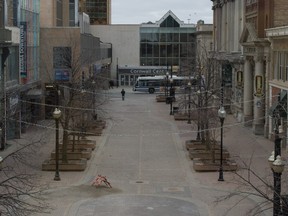 Scarth Street, as it intersects with 11th Avenue at the Cornwall Centre mall, is shown on a cold spring morning in Regina, Saskatchewan on April 1, 2020. This area, normally a hub of bustling downtown activity, sees much less foot traffic since the onset of the COVID-19 pandemic.