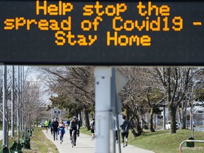 People get exercise outside on the lake shore path along Lake Ontario in Toronto on Thursday, April 2, 2020. Health officials and the government has asks that people stay inside to help curb the spread of the coronavirus also known as COVID-19.