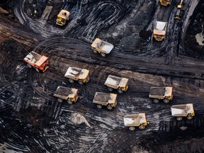 Heavy haulers are seen at the Suncor Energy Inc. Fort Hills mine in this aerial photograph taken above the Athabasca oil sands near Fort McMurray, Alberta, Canada, on Monday, Sept. 10, 2018.