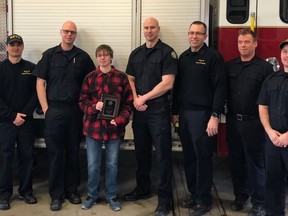 Regina resident Reese B. Wilson was presented with an award from Regina Fire & Protective services for attempting to put out a fire at Walmart in December of last year. (Photo courtesy City of Regina)