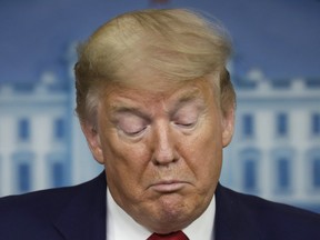 U.S. President Donald Trump reacts during a Coronavirus Task Force news conference at the White House in Washington, D.C., U.S., on Friday, April 3, 2020.