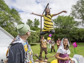 Micheal Martin, left, and Mara Teare, right, listen to a bee played by Megan Zong in Sum Theatre's Theatre in The Park production of the Young Ones in Saskatoon, SK on Monday, June 24, 2019. Saskatoon StarPhoenix / Matt Smith