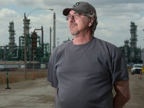 Unifor Local 594 member Paul Woit stands at Gate 7 outside the Co-op Refinery Complex in Regina, Saskatchewan on May 1, 2020. The Local has been locked out by the company since December 5, 2019.