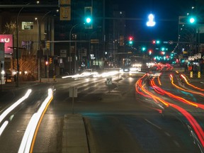 A long exposure shows the blurred lights of vehicles as they travel along Broad Street in Regina, Saskatchewan on May 2, 2020.