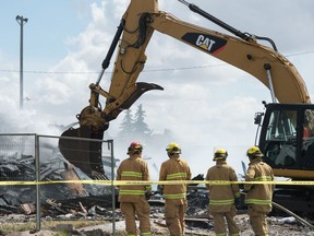 Firefighters work to extinguish a blaze in what's left of the Regina Elks building on 1st Avenue in Regina, Saskatchewan on May 4, 2020.
