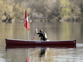 Low winds kept a Unifor flag from flying on a canoe in Wascana Lake as Unifor members drove around the Legislative Building honking in Regina on Wednesday, May 6, 2020.