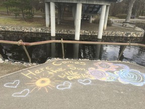 The sunny disposition of many Reginans who have cheerfully endured the COVID-19 pandemic is reflected by this "Here Comes the Sun" message that is written in chalk near the east side of Wascana Lake.