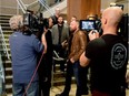 Exclusive photo of Jon Moxley (brown jacket) in the MMA / wrestling movie Cagefighter: Worlds Collide, which premieres on FITE TV on May 16, 2020. Much of the film was shot in Regina, Sask., including this scene in the DoubleTree by Hilton Hotel in downtown Regina.