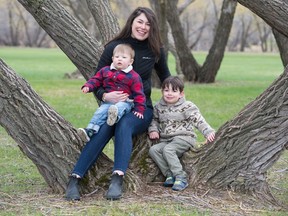 Whitney Blaisdell, centre, poses for a photo with her kids August Kissick, lef,t and Jonah Kissick in a park in Regina, Saskatchewan on May 13, 2020. Blaisdell is a graduate student in the Faculty of Education and founder of Project Play YQR. Project Play YQR has a partnership with the Regina Early Learning Centre to explore ways to use social media and crowdsourcing to support families while they are more isolated in home environments.
