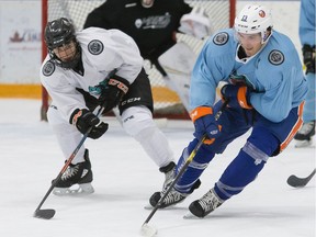 Regina Pats top prospect Connor Bedard (white) defends against NHL star Mathew Barzal during a charity tournament in Vancouver last summer.