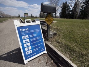 A sign of COVID-19 restrictions sits beside the first tee box at the Murray Golf Course on Thursday.