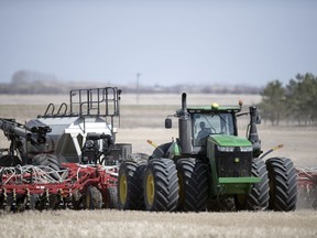 A farmer seeds his field north of Regina on Thursday, May 14, 2020.