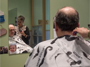 Rob Vanstone gets a haircut from Nancy McCurdy at Randy's Hair Studio on Tuesday.