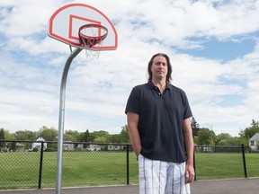 Murray Giesbrecht, executive director of the North Central Community Association (NCCA), stands on the basketball court outside the mamaweyatitan centre in Regina, Saskatchewan on May 26, 2020. The NCCA runs a community basketball program, which has been affected by the COVID-19 pandemic.