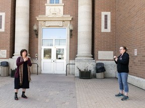 Joanne Weber, artistic director of the Deaf Crows Collective, left, and Michelle Grodecki, a teacher with the Winston Knoll Deaf and Hard of Hearing Program, use sign language to communicate in Regina on Friday, May 8, 2020.